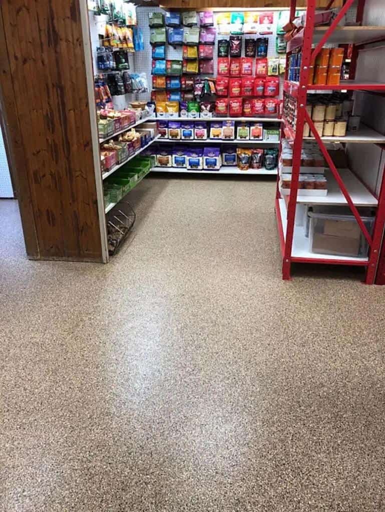 Storage room with a full-flake polyaspartic and epoxy coating topped with shelving. 